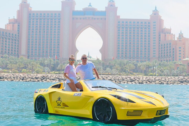 Experience the thrill of driving a supercar on water while gliding past Dubai's stunning skyline. Discover the joy of exploration and create lasting memories in this unique adventure.